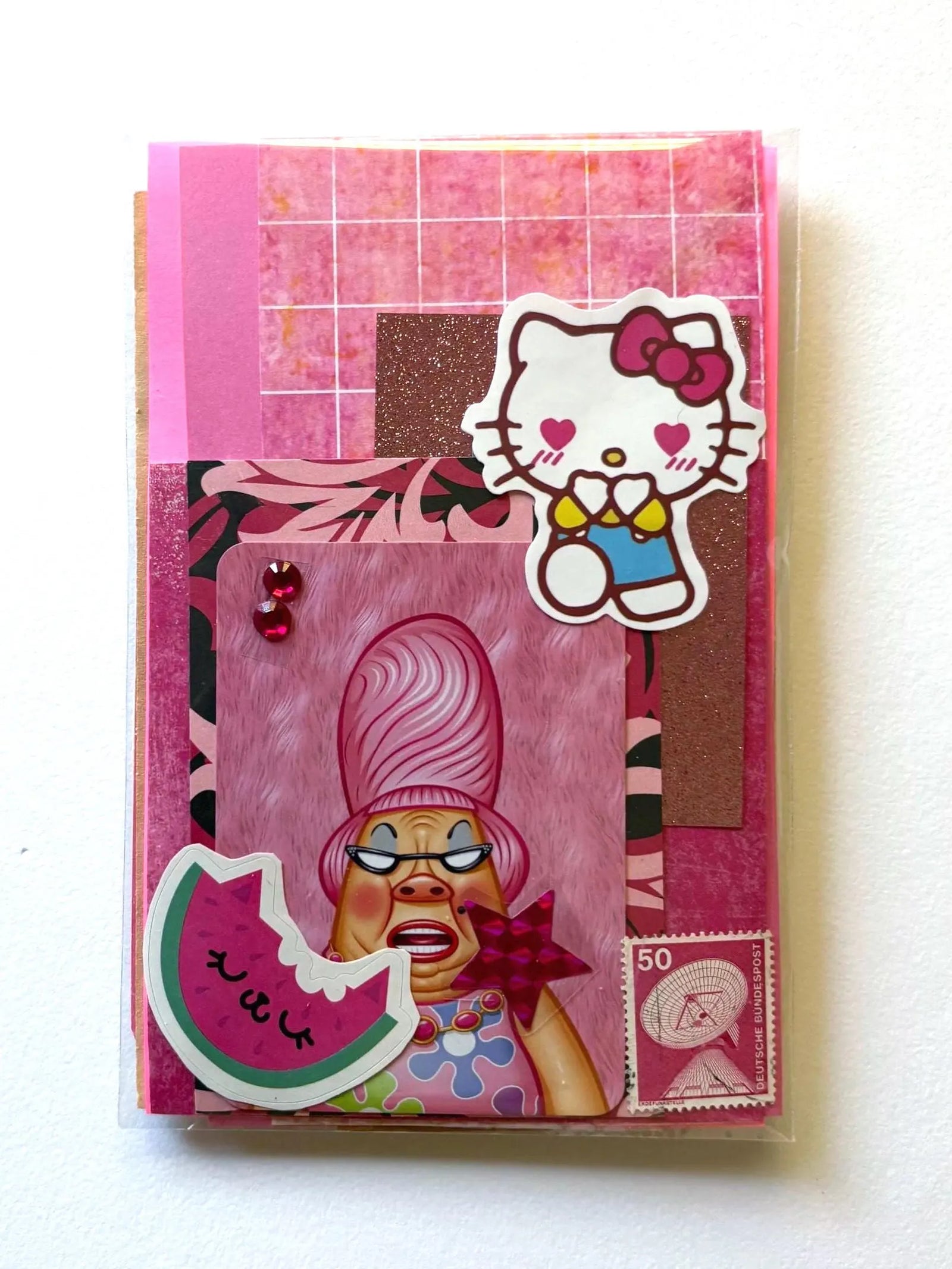 Mystery Ephemera Kit, authentic vintage junk journal kit with different shades and textures of pink decorative papers, stickers, pompoms, cancelled stamps, etc. 
