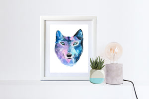 Watercolor Wolf Art Print shown white frame with lamp and plant next to it