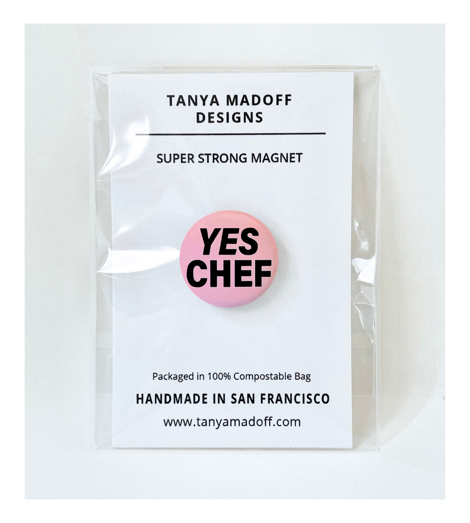 Yes Chef one inch pin back button (badge) or one inch super strong magnet.